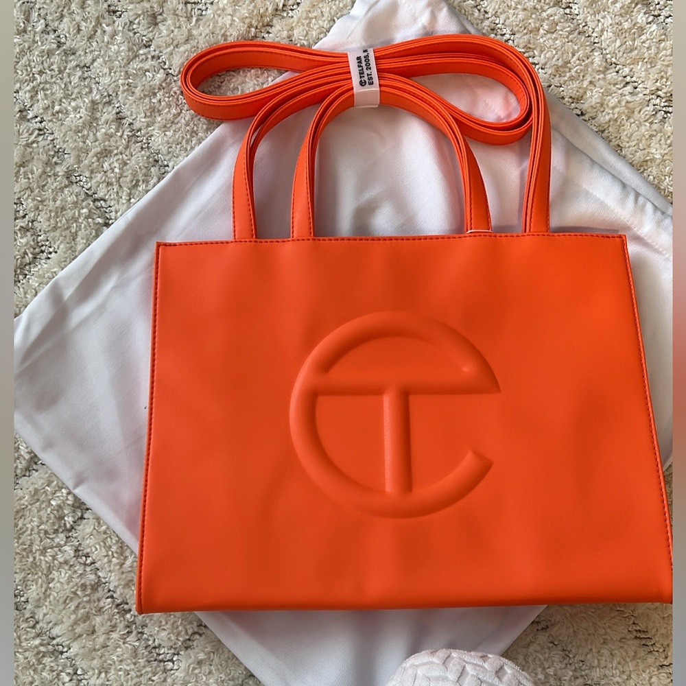 Size medium Orange Telfar. 

Tag still included, never used. Dust bag included.